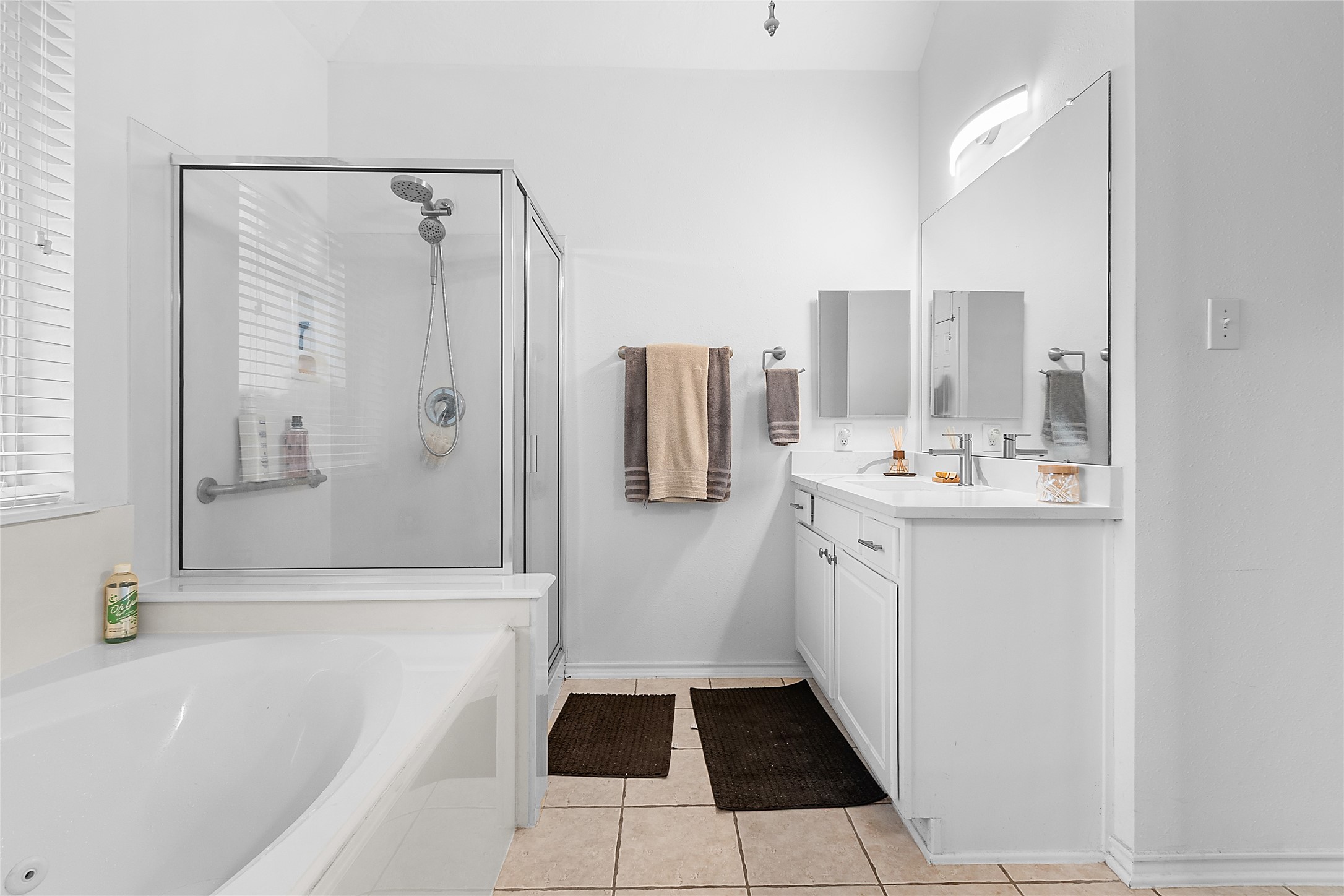 21014 Jessica Rose Lane Spring, TX 77379 - Photo 23 of 30 a bathroom with a tub sink and mirror
