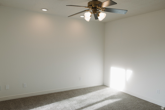 215 South 1050th West, Unit 10 Provo, UT 84601 - Photo 20 of 38 Empty room with a ceiling fan, carpet flooring, and recessed lighting