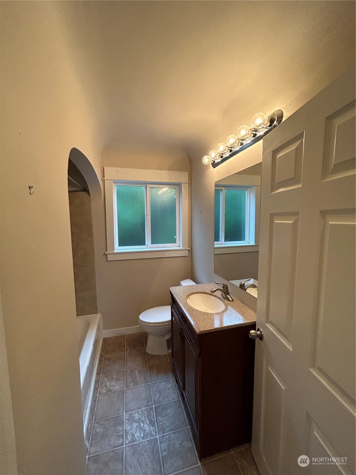 6919 Cady Road Everett, WA 98203 - Photo 16 of 29 a bathroom with a toilet sink and mirror