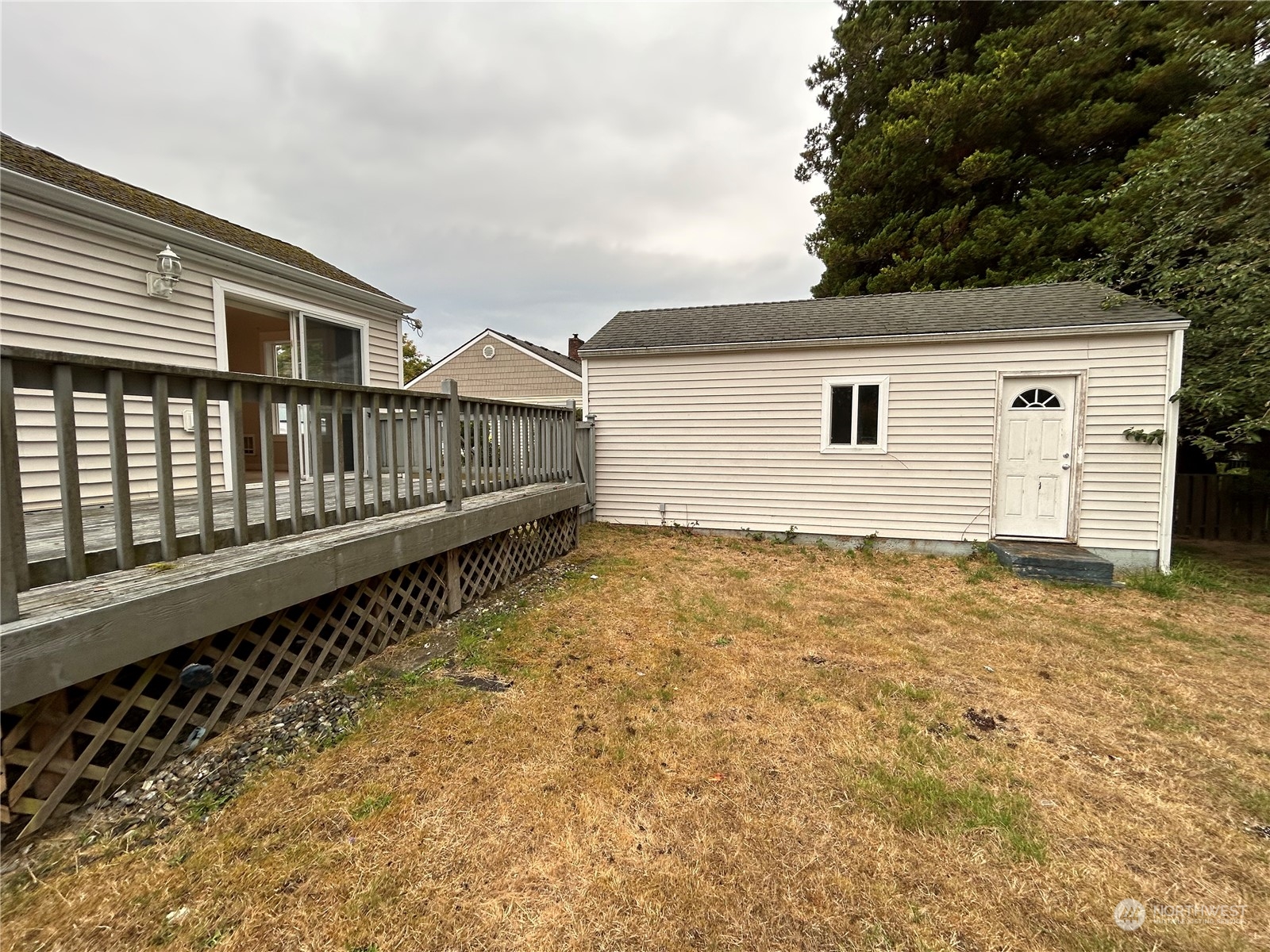 6919 Cady Road Everett, WA 98203 - Photo 26 of 29 a view of a house with wooden fence