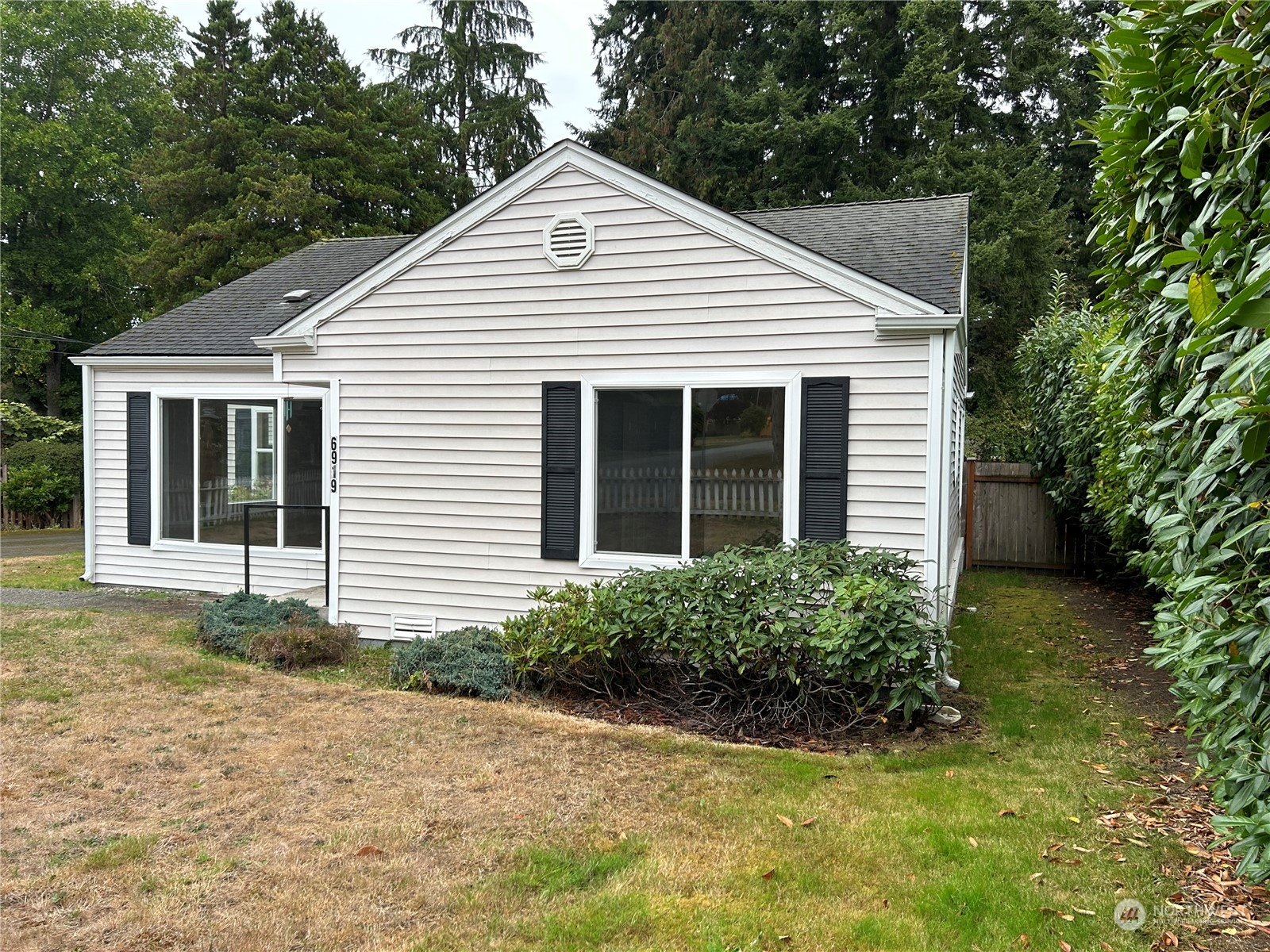 6919 Cady Road Everett, WA 98203 - Photo 29 of 29 a view of a house with a yard and potted plants