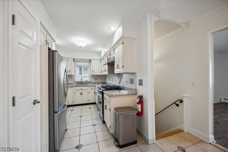 175 Chestnut Street, Unit B Boonton, NJ 07005 - Photo 11 of 30 a kitchen with a sink stove and refrigerator