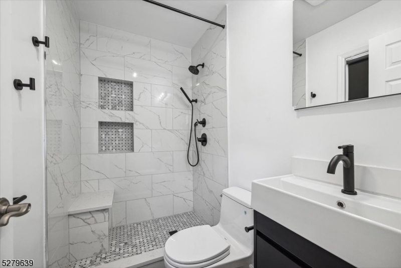 175 Chestnut Street, Unit B Boonton, NJ 07005 - Photo 22 of 30 a bathroom with a sink toilet and shower