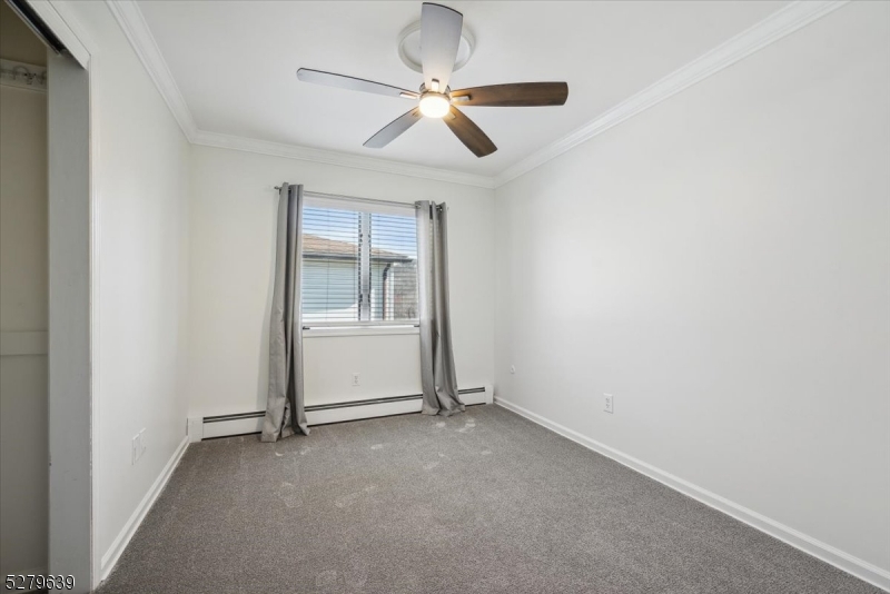 175 Chestnut Street, Unit B Boonton, NJ 07005 - Photo 25 of 30 a view of a livingroom with a ceiling fan and window