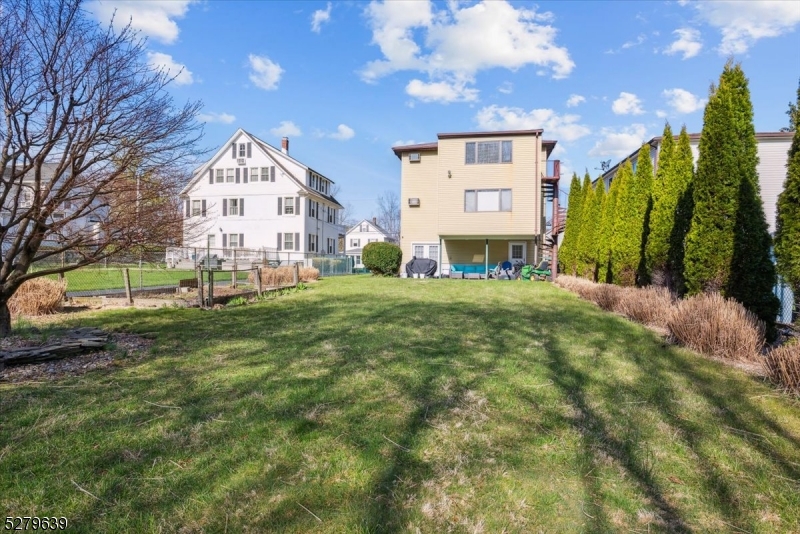 175 Chestnut Street, Unit B Boonton, NJ 07005 - Photo 28 of 30 a view of a house with a yard
