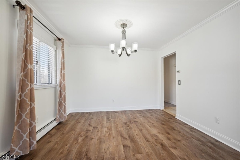 175 Chestnut Street, Unit B Boonton, NJ 07005 - Photo 7 of 30 a view of a room with wooden floor staircase and a hallway