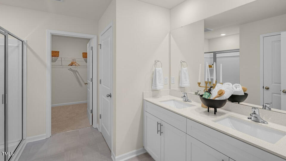 1256 Pavo Path Wendell, NC 27591 - Photo 15 of 30 a bathroom with a sink double vanity and mirror