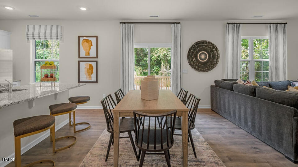 1256 Pavo Path Wendell, NC 27591 - Photo 5 of 30 a dining room with furniture and window