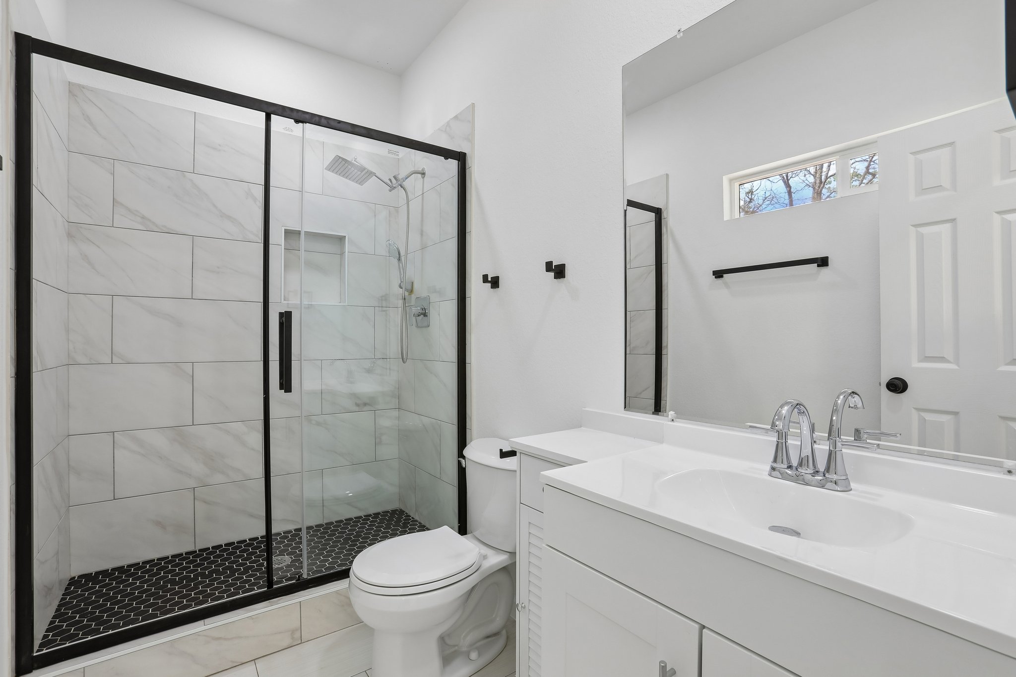210 Flint Ridge Street Bastrop, TX 78602 - Photo 32 of 40 a bathroom with a sink toilet and shower