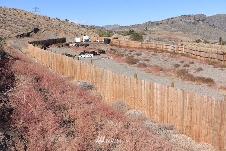 30007 Highway 97 Riverside, WA 98849 - Photo 19 of 31 a view of a dry yard with wooden fence