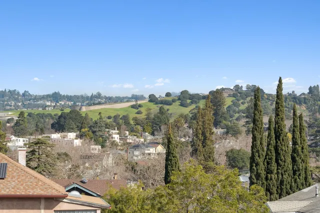 a bed room with a bed and a chair