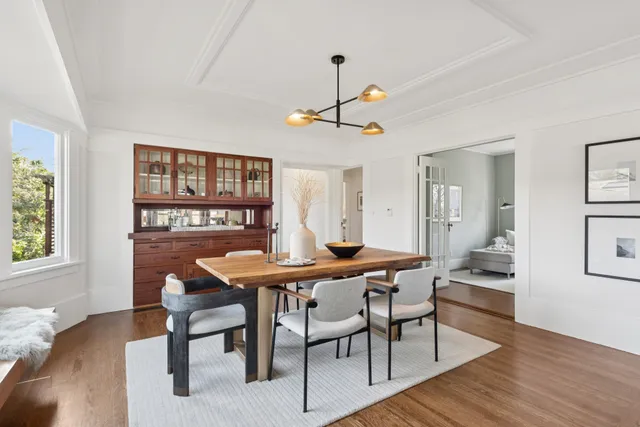 a view of a dining room with furniture and wooden floor