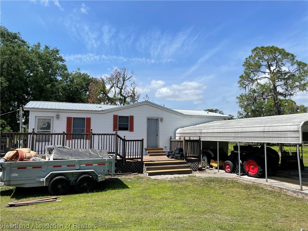 a view of a house with porch and a patio