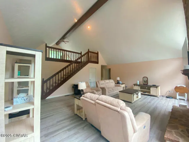a bathroom with a shower and a bath tub