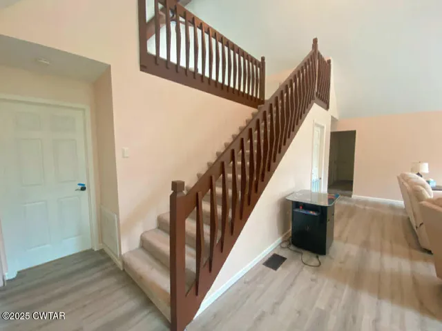 a bedroom with a bed and a night stand