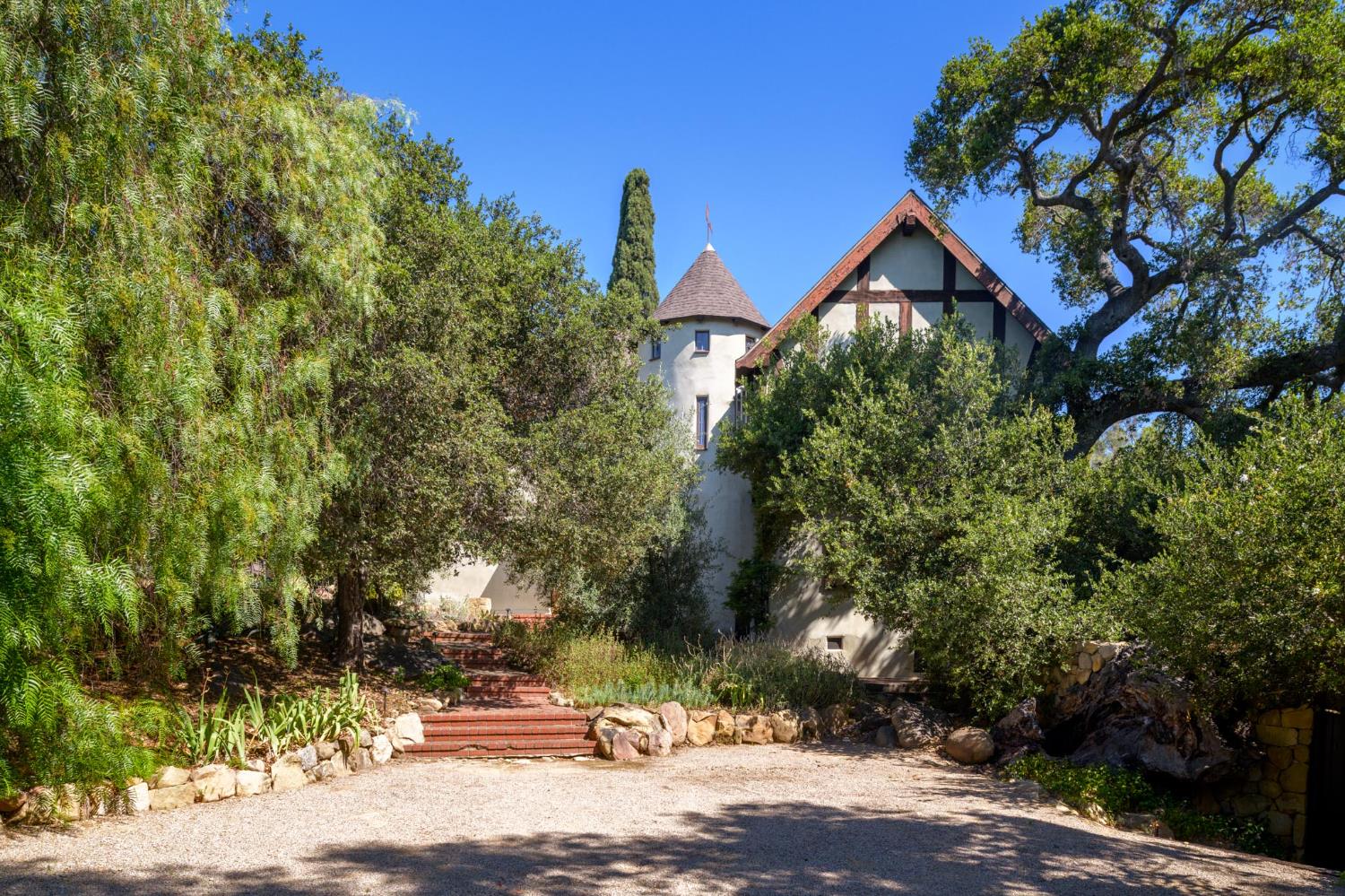520 Foothill Road Ojai, CA 93023 - Photo 36 of 45 a front view of a house with a yard and tree