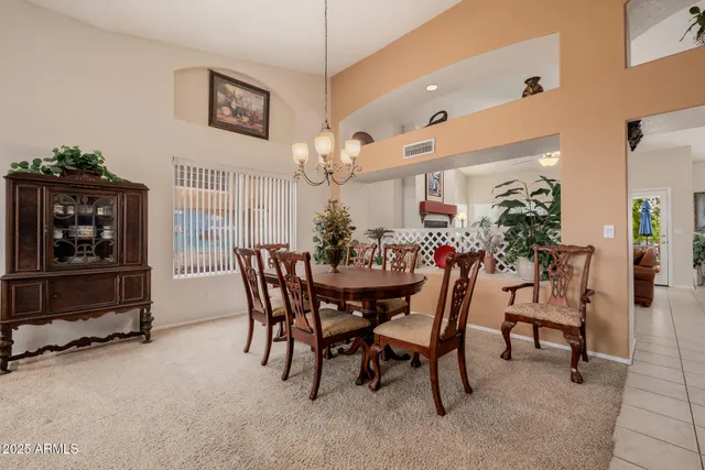 a dining room with furniture and window