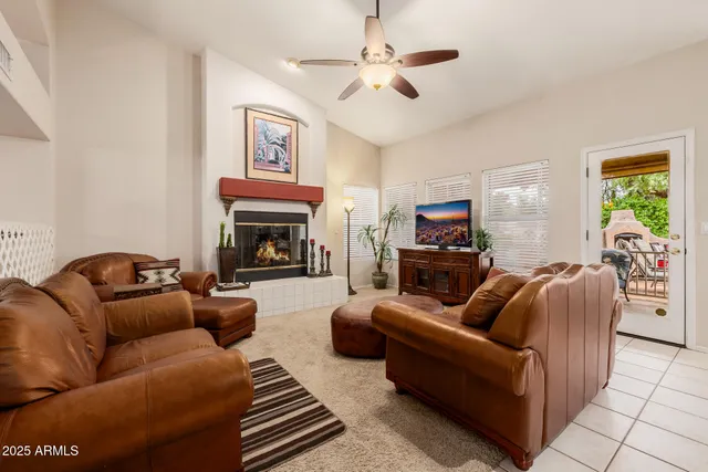 a large kitchen with kitchen island a sink a counter space and living room view