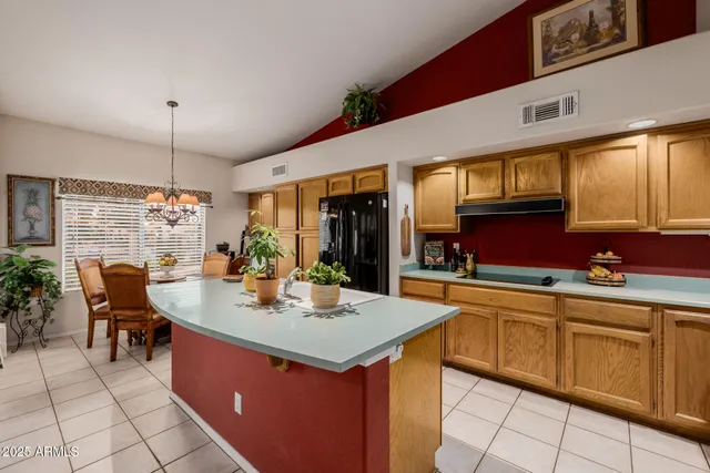 a bathroom with a double vanity sink a toilet and shower