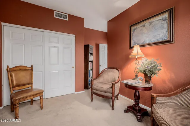 a view of swimming pool with a table and chairs under an umbrella