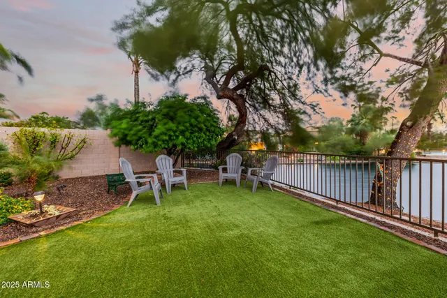an aerial view of a house with a yard and garden