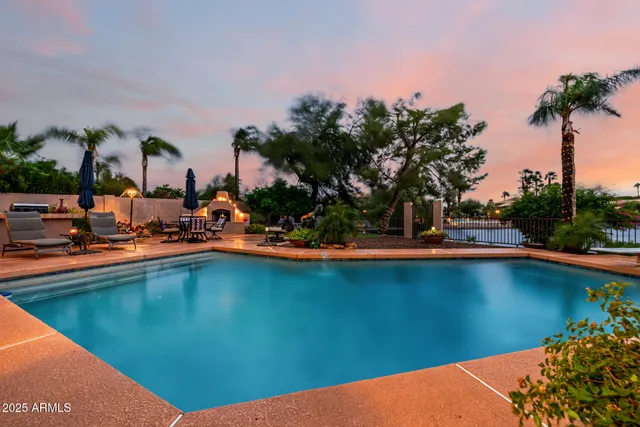 an aerial view of a house with a lake view