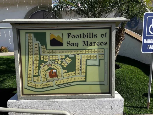 a living room with table chairs and a table