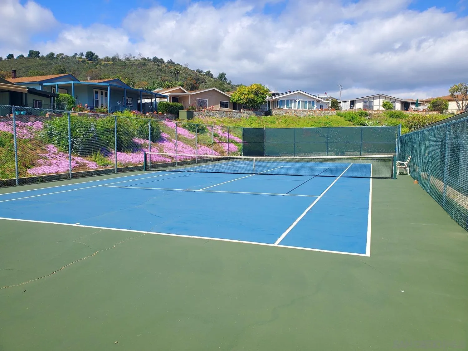 909 Richland Road, Unit 134 San Marcos, CA 92069 - Photo 37 of 44 a view of a tennis court