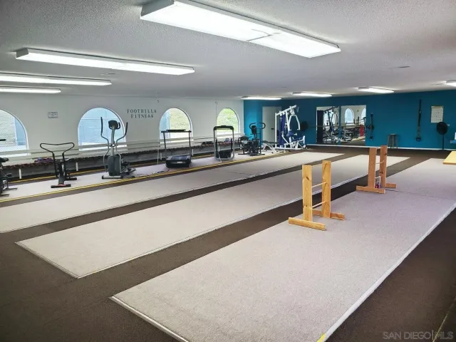 a kitchen with stainless steel appliances a stove a sink and a refrigerator