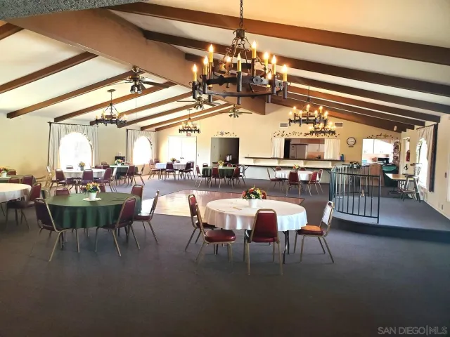 a room with pool table and window