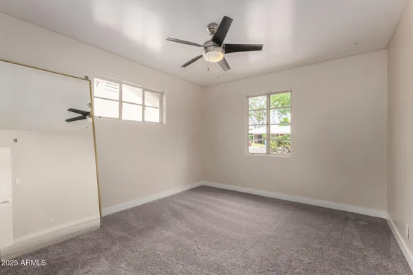 a view of an empty room with a window