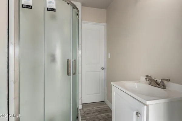 a bathroom with a sink and vanity