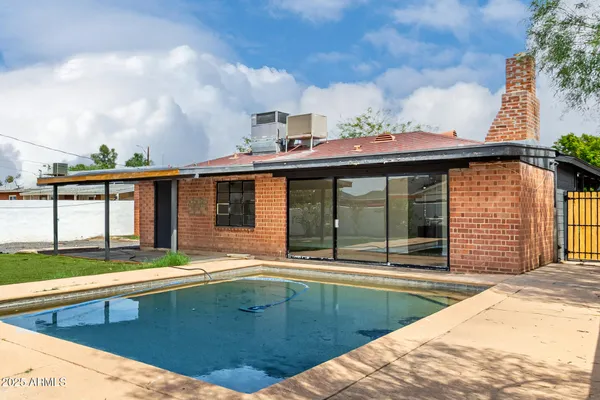 a view of pool with outdoor seating