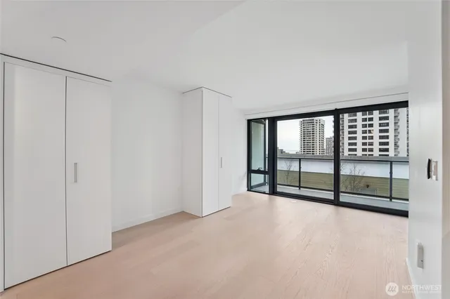 a view of an empty room with a window