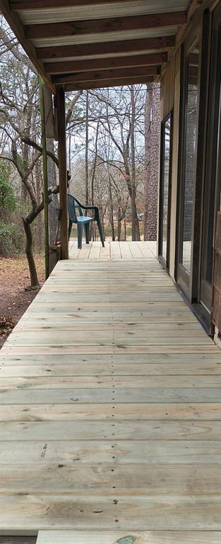 106 Sandy Lane Road Scroggins, TX 75480 - Photo 11 of 27 a large white bed in a blue room