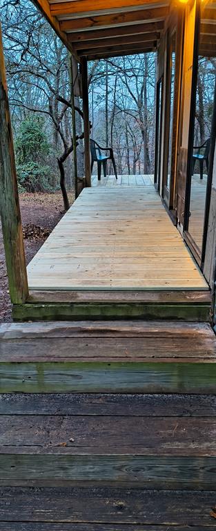 106 Sandy Lane Road Scroggins, TX 75480 - Photo 24 of 27 a view of backyard with wooden floor