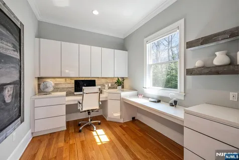a kitchen that has a sink and a stove in it