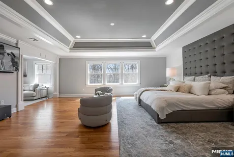 a spacious bedroom with a bed and window