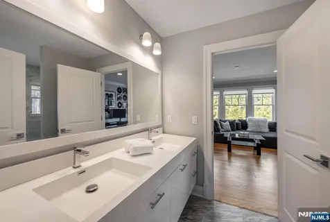 a en suite bathroom with a sink and mirror