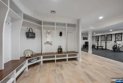 a view of a livingroom with hardwood floor and a ceiling fan
