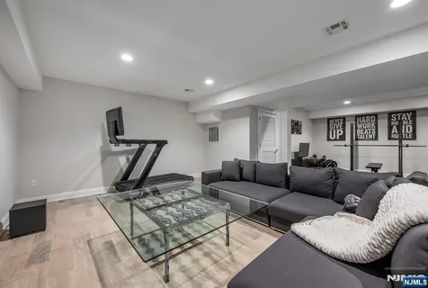a living room with furniture and a rug
