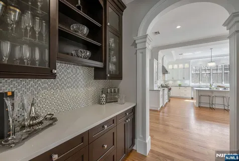 a kitchen with stainless steel appliances a sink and cabinets