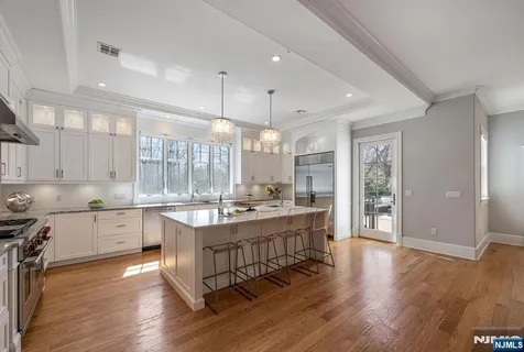 a large kitchen with a table and chairs in it
