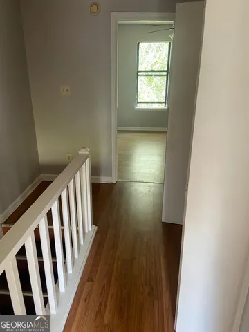 a bathroom with a granite countertop toilet and a sink
