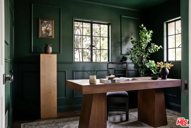 a dining room with a table and chairs in it