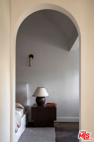 a bedroom with bed and window