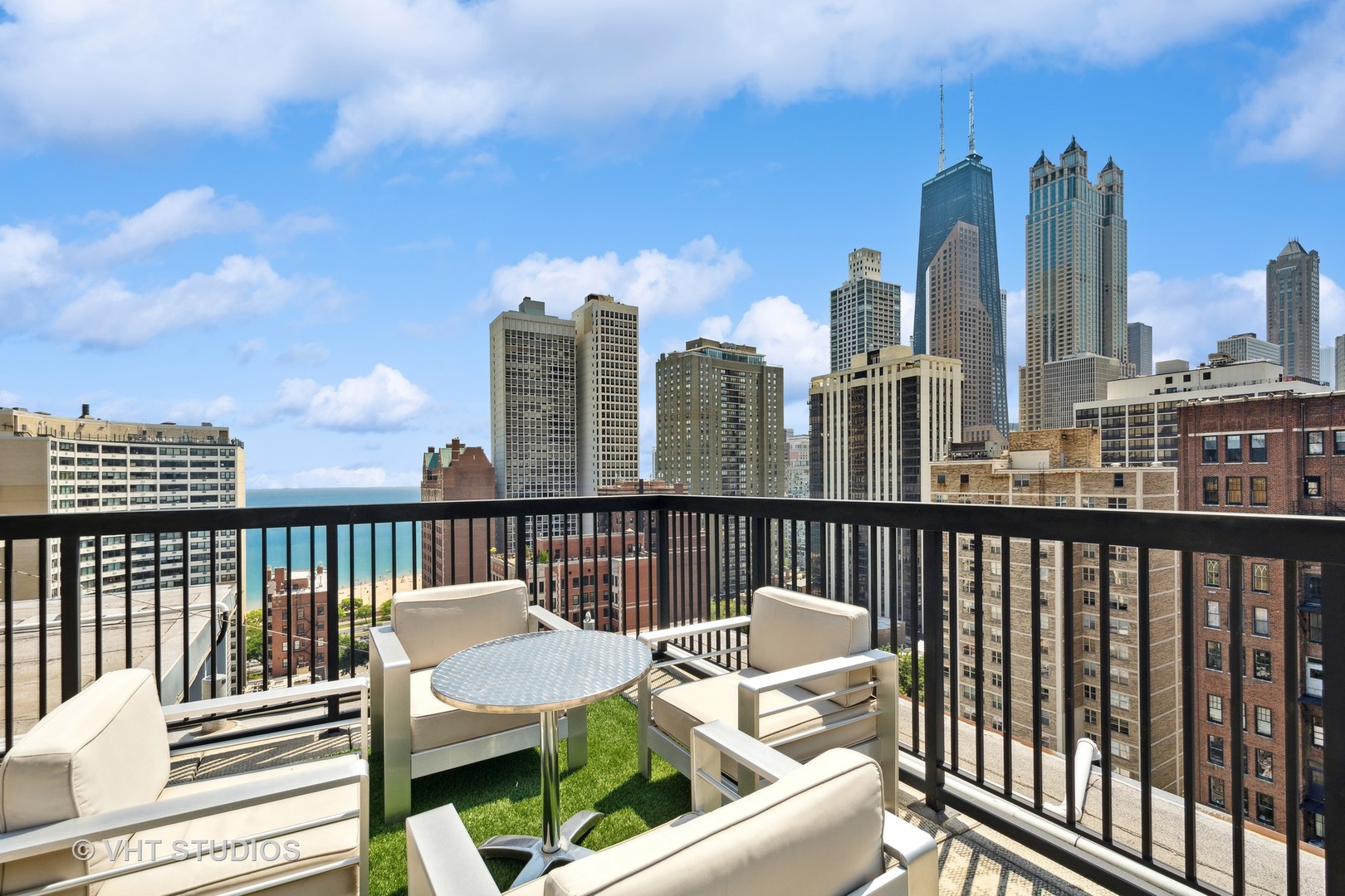 30 East Elm Street, Unit 18A Chicago, IL 60611 - Photo 15 of 16 a view of a balcony with two chairs and a deck