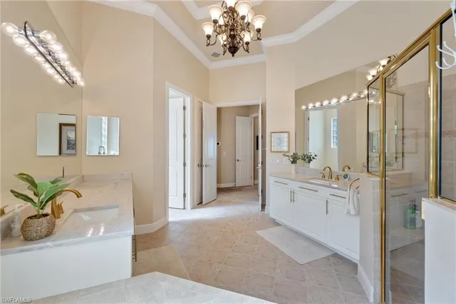 a large white kitchen with a large tub
