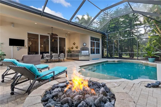 a view of a swimming pool with a patio