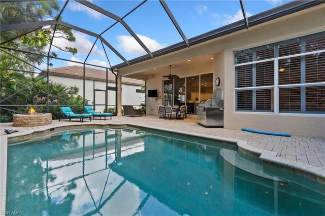 an aerial view of a house with swimming pool